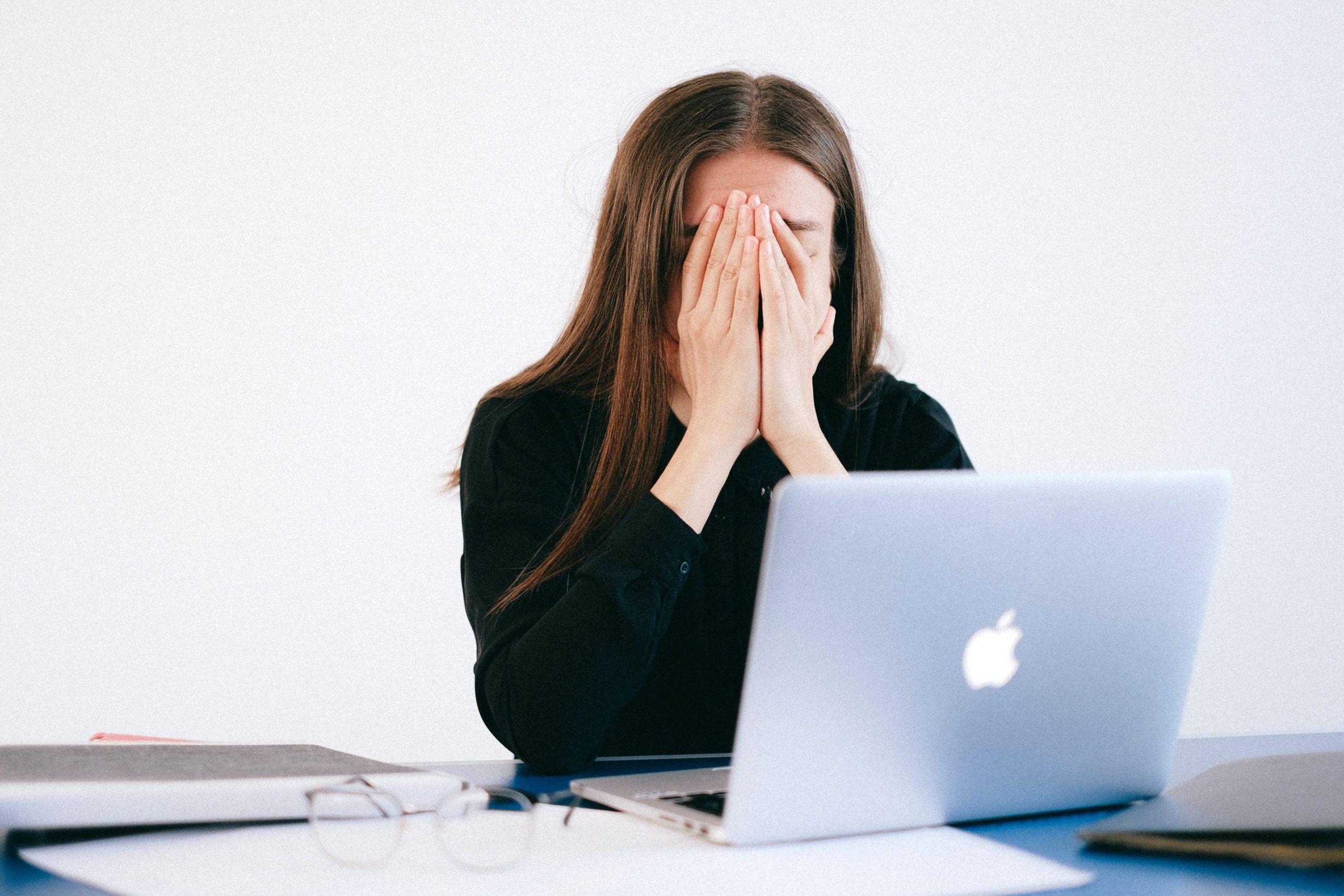 woman-with-hands-on-her-face-in-front-of-a-laptop-4226215